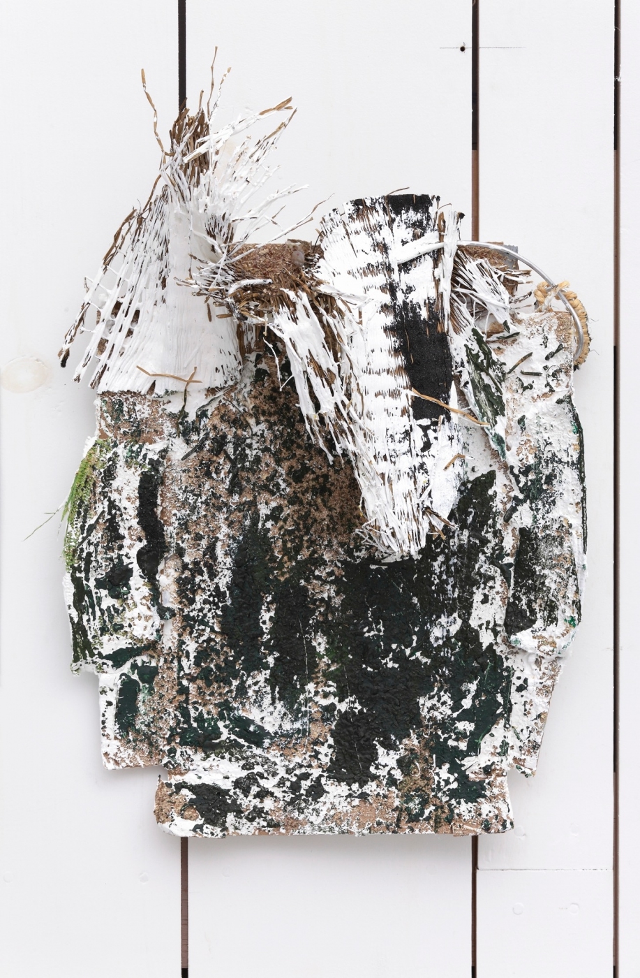 Meat Helmet I, 2014,
grass mat, sawdust, wire, twine and enamel on cardboard, 18 1/2 × 13 1/4 inches