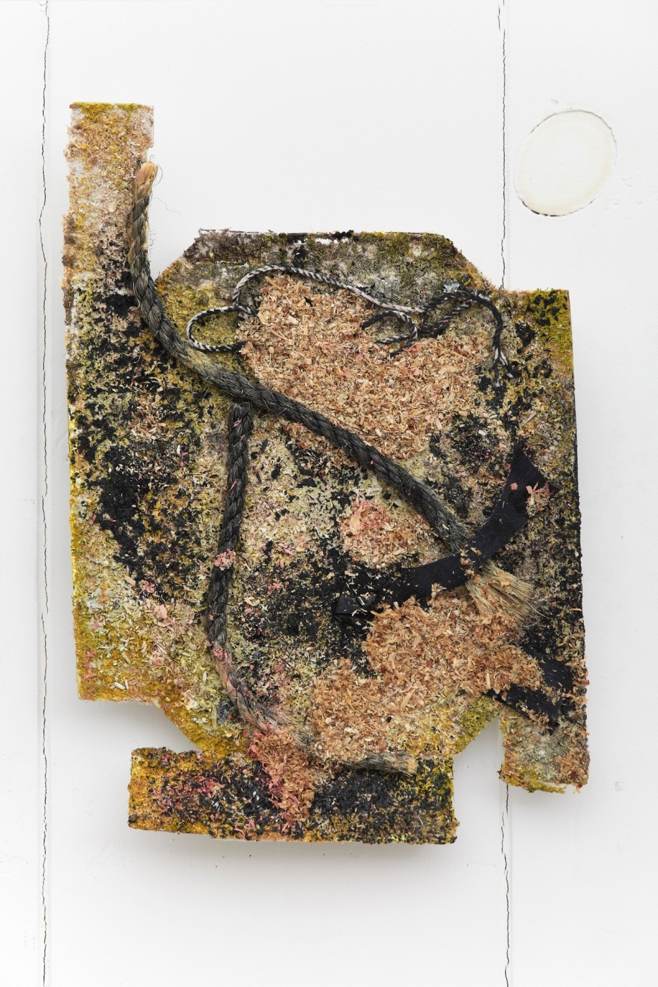 Empathic Traffic, 2014,
sawdust, rope, linen and enamel on cardboard, 11 3/4 × 8 inches