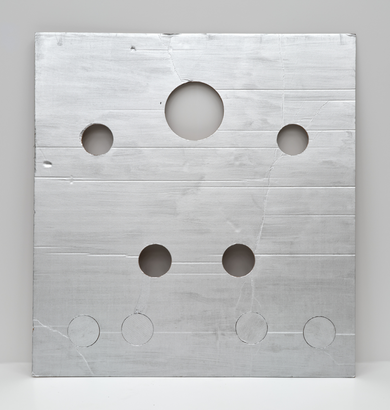 Cady Noland, (Not Yet Titled) Parkett 46, 1996. Cardboard, lacquer-based sanding sealer and aluminum enamel spray paint, 55½ x 51⅞ in. (140.97 x 131.78 cm)
