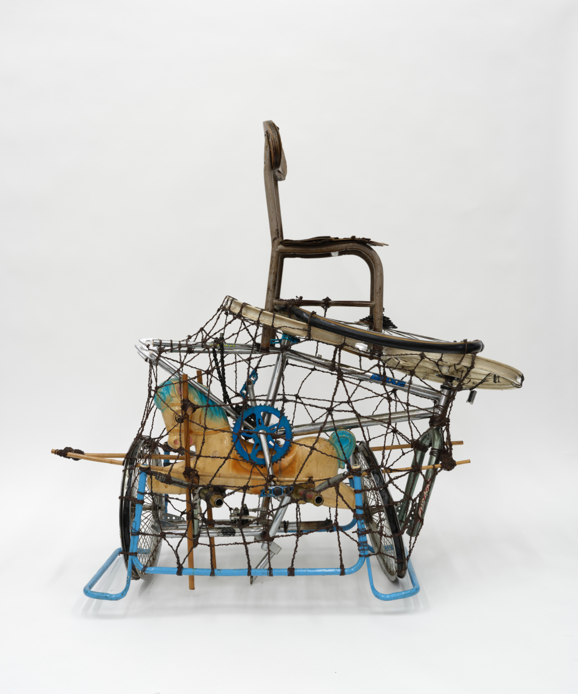 Toy Horse, 2002. Metal, wire, toy horse, chair and plastic, 53 x 29 x 55 in. (134.62 x 73.66 x 139.70 cm)
