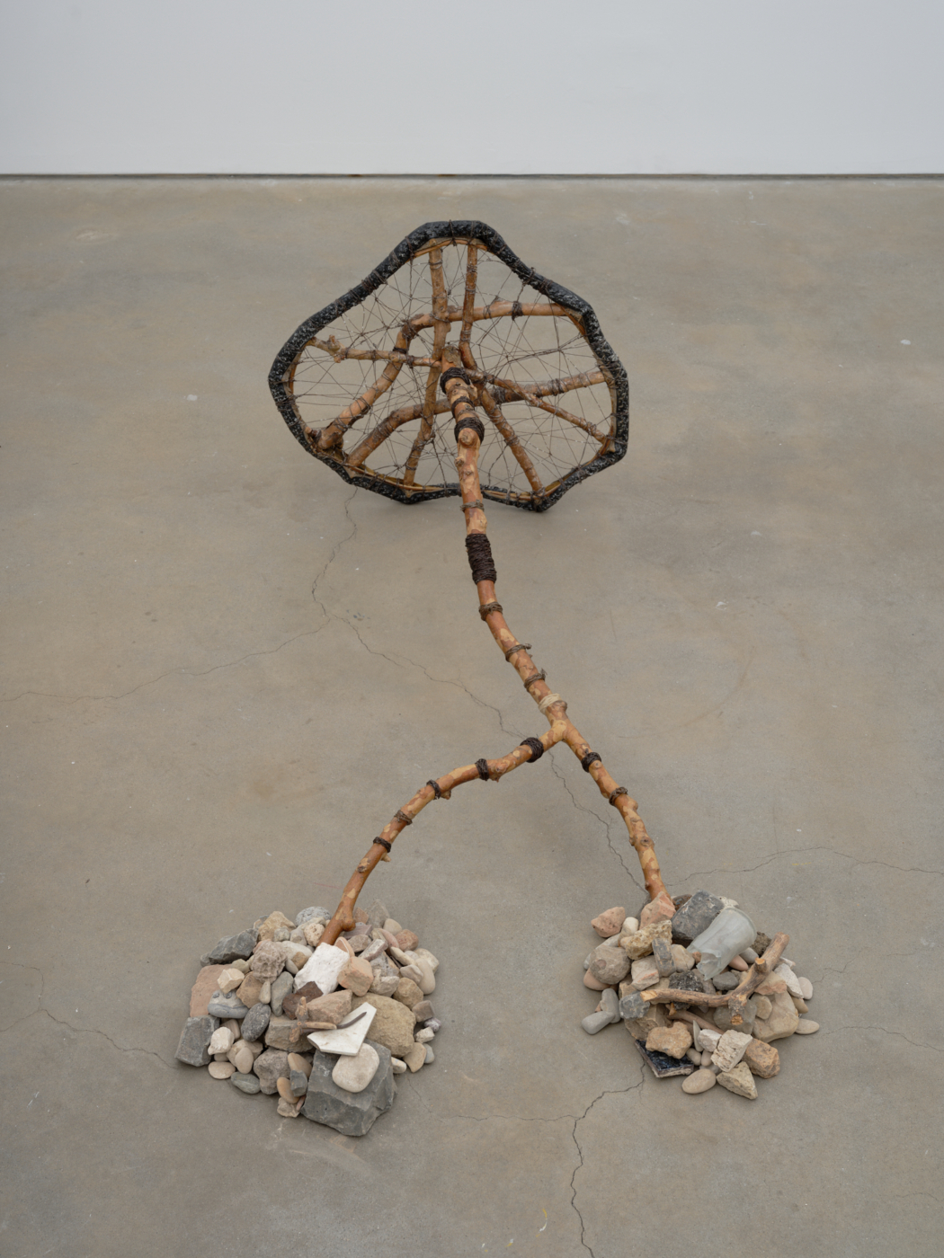 Wheel, 2003. Wood, wire, stones, rocks, glass, tire, and metal, 24 x 60 x 32 in. (60.96 x 152.40 x 81.28 cm)