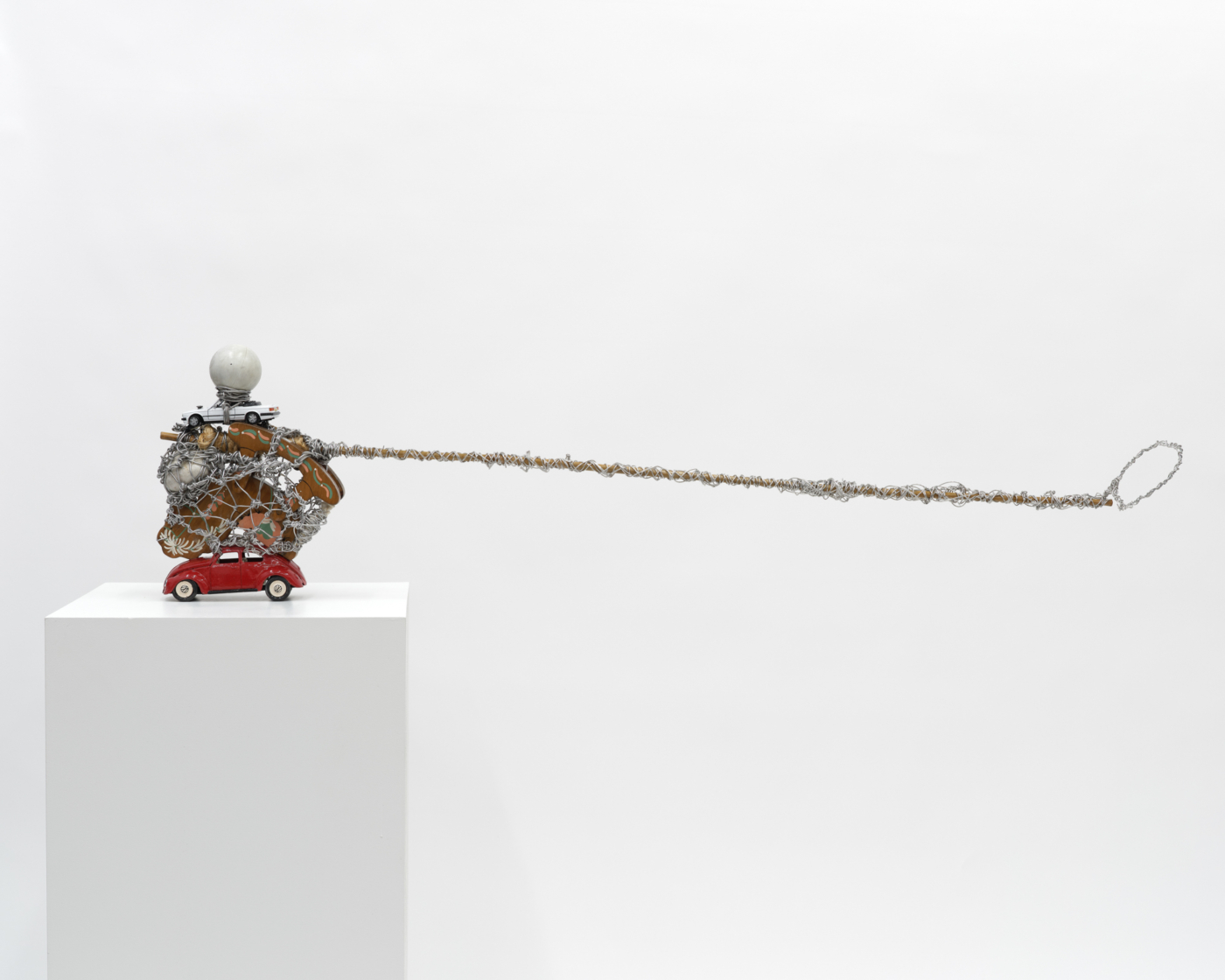 Crab Fishing in 69, 2024. Wire, wood, toy cars, screws, stone, bamboo, rope and ball, 13 x 50 x 5 in. (33.02 x 127.00 x 12.70 cm)