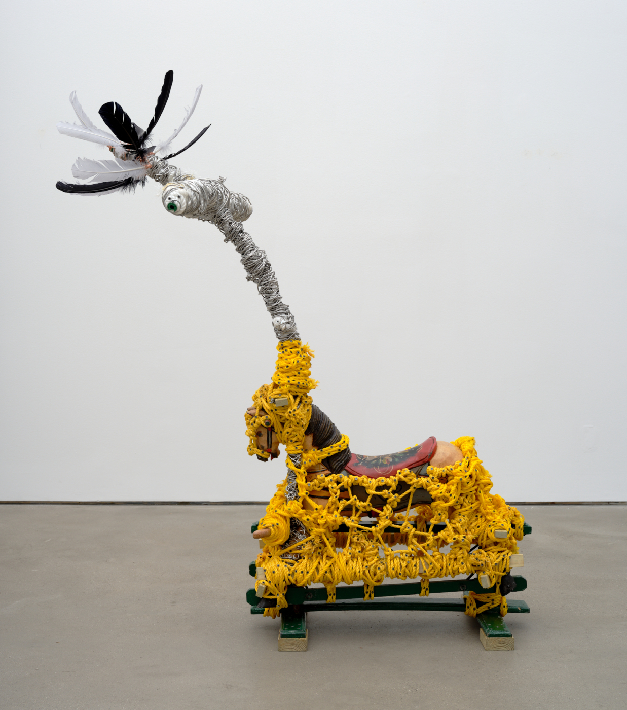 Conquistador in the New World, 2024. Feathers, wire, rope, toy horse, wood, screws, glue, and plastic spools, 69 1/4 x 59 3/4 x 27 1/2 in. (175.90 x 151.76 x 69.85 cm)