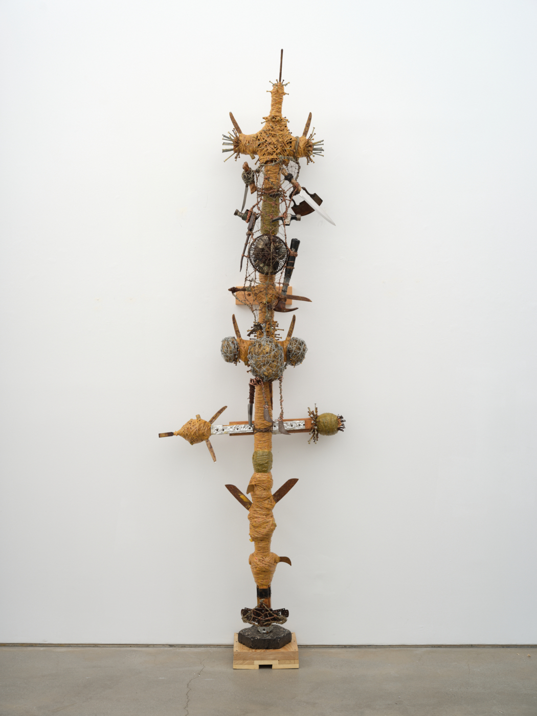 The Knife and the Hammer, Fear of Aggression, 1994. Rope, glue, hammers, wood, knives, blades, wire, metal, screws, stones, monetary note, nails, cobblestone, and pencil, 107 ¼ x 34 x 15 in. (272.41 x 86.36 x 38.10 cm)
