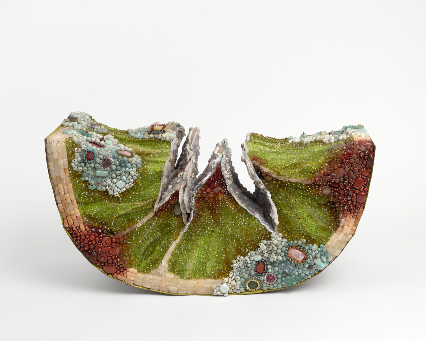 Kathleen Ryan, Bad Lime (Rock Candy), 2026. Agate, angelite, amazonite, druzy amethyst, amethyst, turquoise, magnesite, aventurine, rhodonite, carnelian, fluorite, calcite, garnet, labradorite, ruby, quartz, rose quartz, jasper, serpentine, marble, glass, steel pins on coated polystyrene, and car hood, 17 x 31½ x 17 in. (43.18 x 80.01 x 43.18 cm)