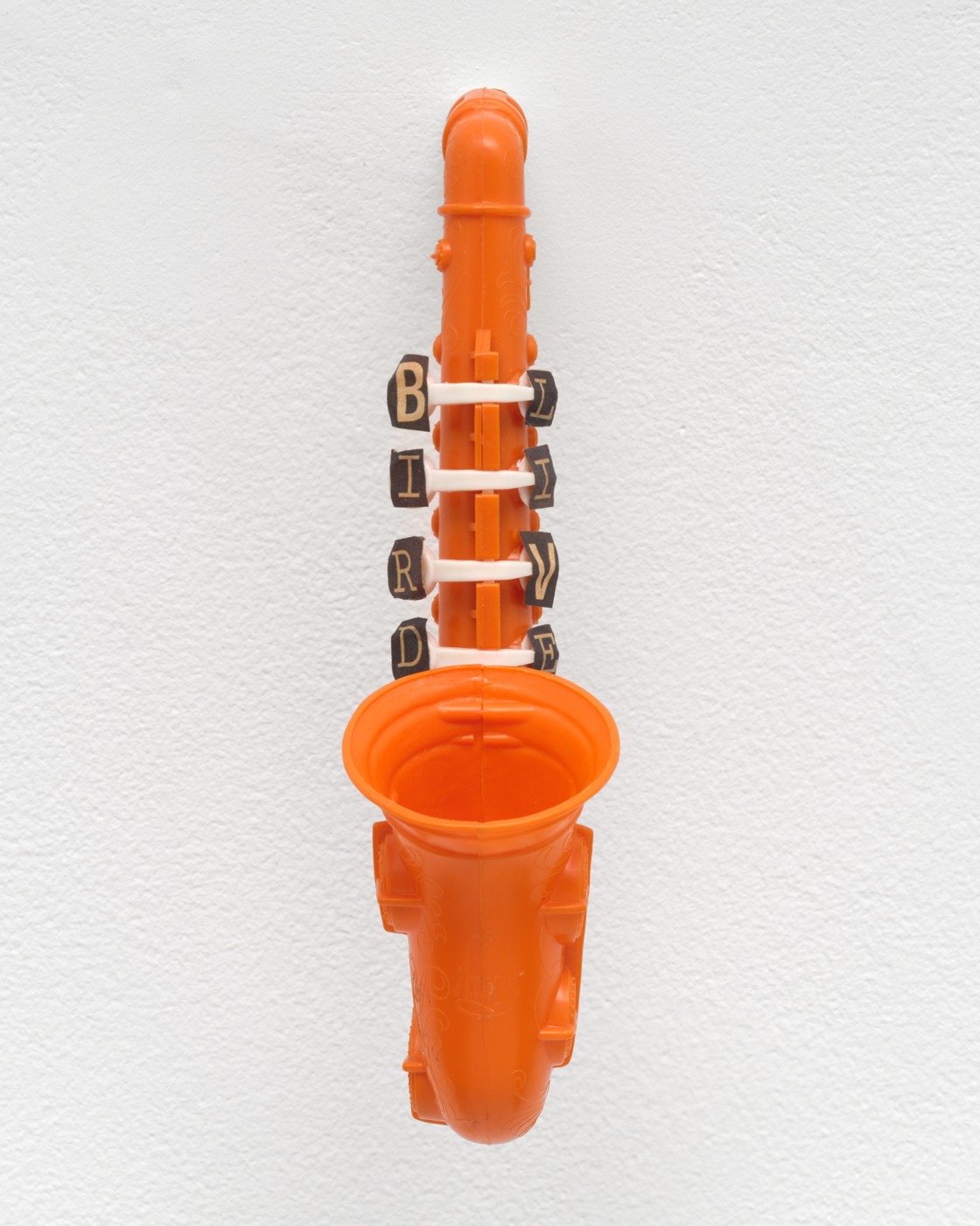 Ted Joans, Bird Lives, n.d. Plastic toy saxophone and cutout paper letters, 9⅛ x 2¼ x 5⅛ in. (23.19 x 5.71 x 13.03 cm)