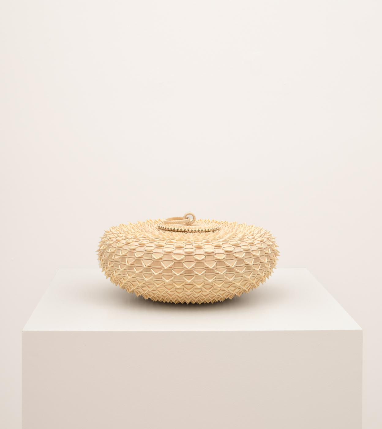 Jeremy Frey, Urchin, 2026. Ash and sweetgrass, 5 1/2 x 11 x 11 in. (13.97 x 27.94 x 27.94 cm)